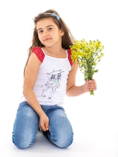 Little girl with a bouquet of flowers — Stock Photo, Image