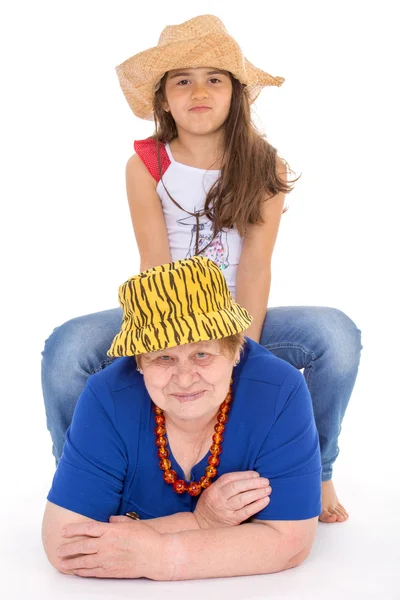 Grandmother and granddaughter in hats. — Stock Photo, Image