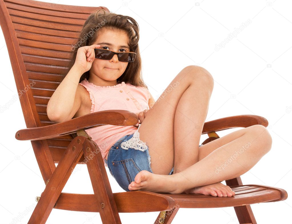 little girl on a sunbed