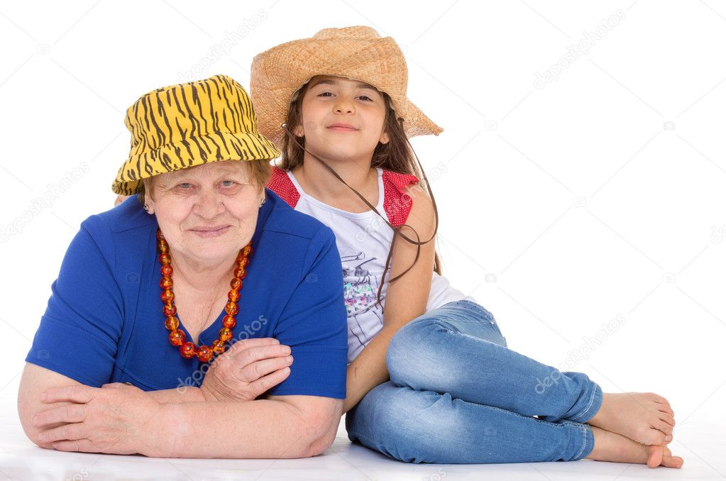 grandmother and granddaughter in hats.