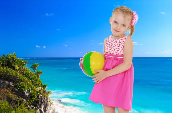 Girl on a background of blue sea — Stock Photo, Image