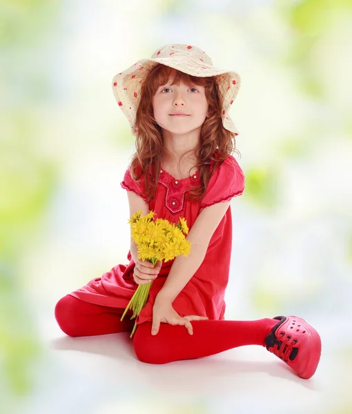 Little girl with yellow flowers — Stock Photo, Image