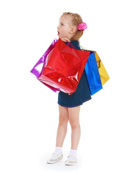 Blonde little girl holding a lot — Stock Photo, Image
