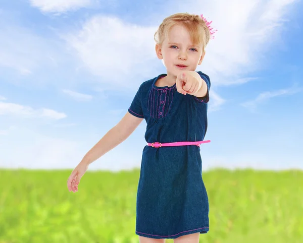 Girl showing forefinger aside — Stock Photo, Image