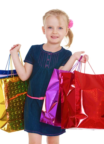 Little girl with a big package — Stock Photo, Image