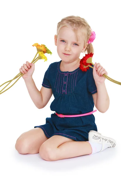 Little girl with colorful flowers — Stock Photo, Image