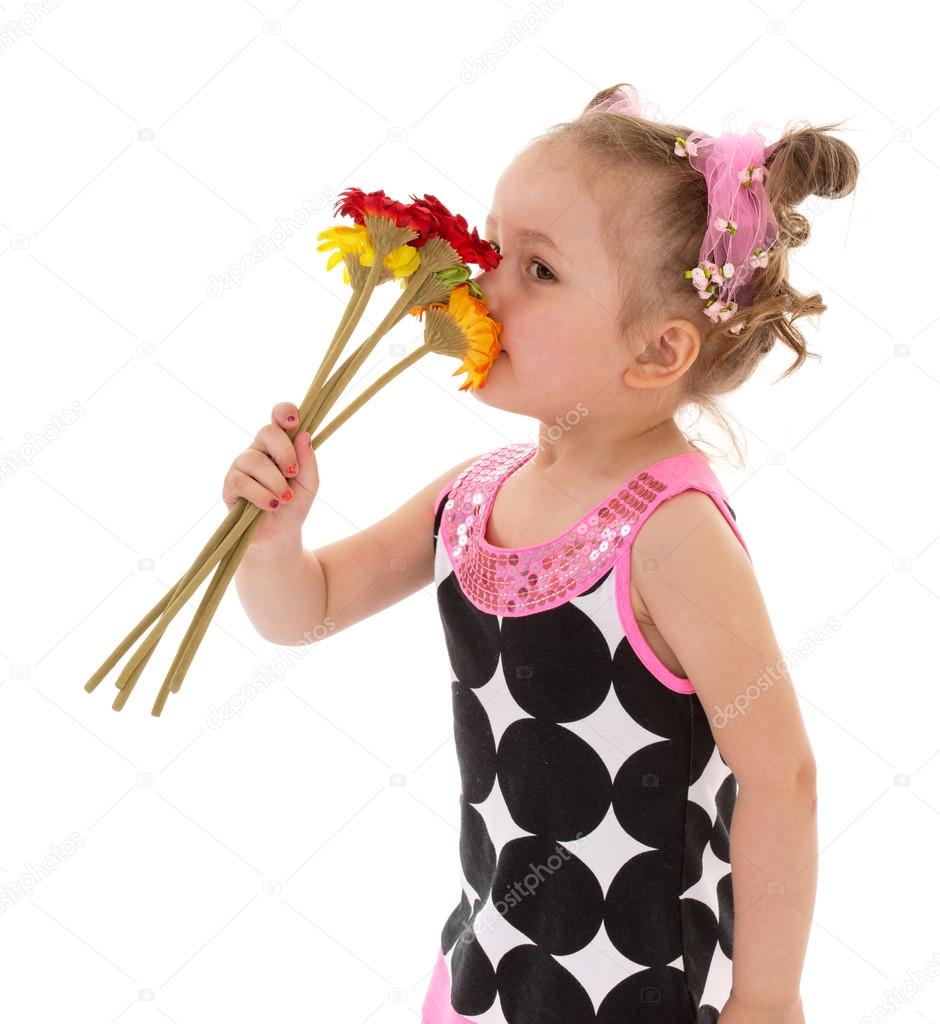 Little girl posing with a bouquet