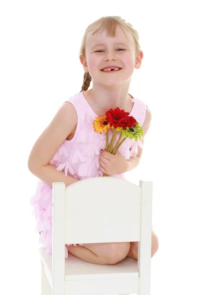 Adorable child holding bouquet — Stock Photo, Image