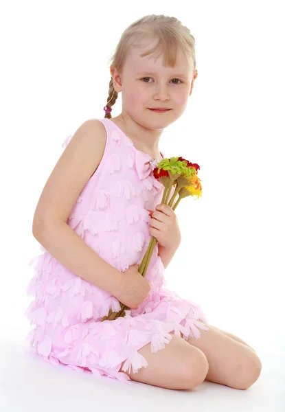 Adorable child with a bouquet — Stock Photo, Image