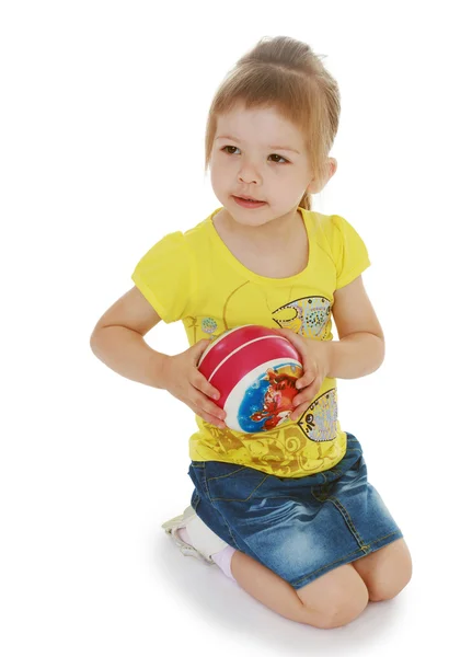 Little girl hugging the ball. — Stock Photo, Image