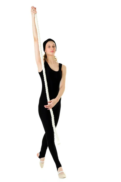 Slank tienermeisje gymnastiek training met touw swing — Stockfoto