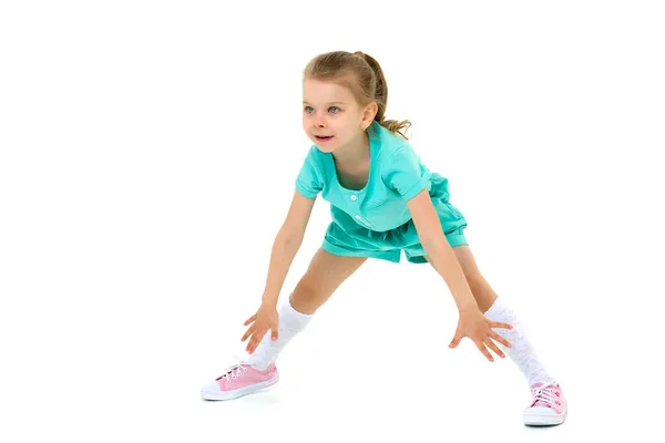 Adorable active little girl robi podział na podłodze — Zdjęcie stockowe