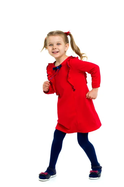 Carino bambina con code di cavallo in abito rosso — Foto Stock