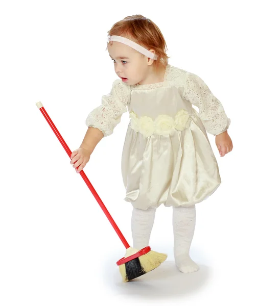 Young girl sweeping the floor — Stock Photo, Image