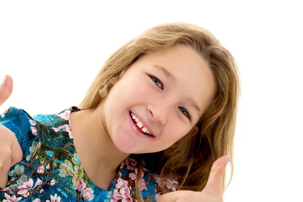 Little girl shows thumb up. — Stock Photo, Image