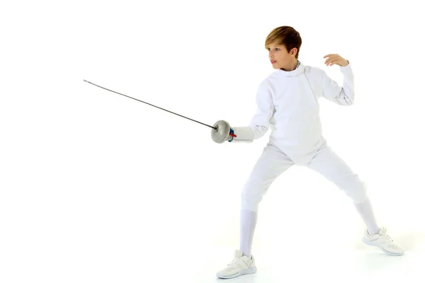 Boy fencer standing in attacking pose — Stock Photo, Image