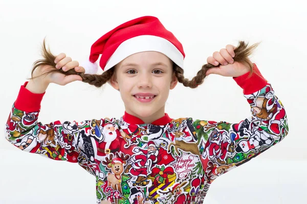 Happy young girl with pigtails and Santa cap — Stock Photo, Image