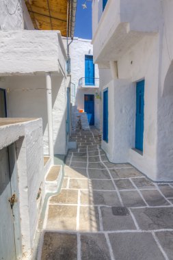 Narrow alley in Kimolos island, Cyclades, Greece clipart