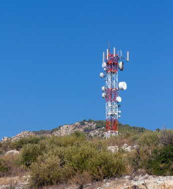 Telecommunication tower on a hill clipart