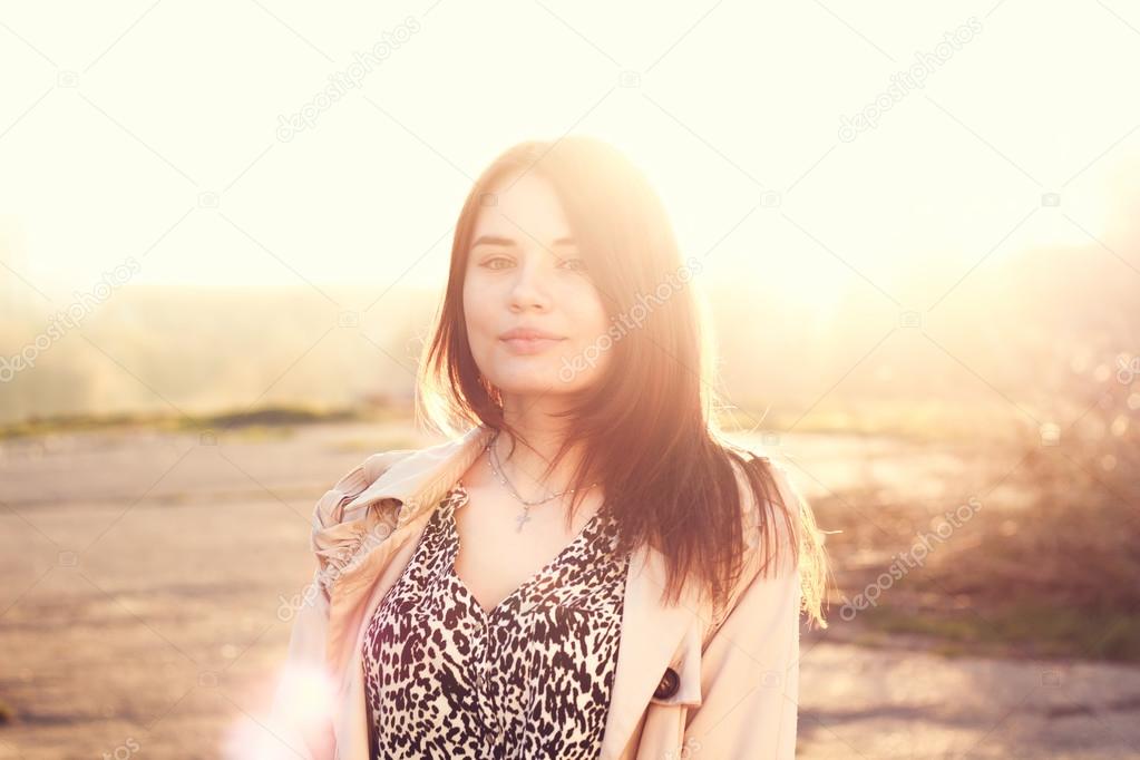 Young beautiful girl smiling portrait outdoor