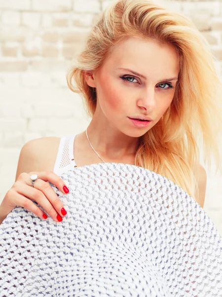 Portrait of fashionable girl with a hat on her head over white background — Stock Photo, Image