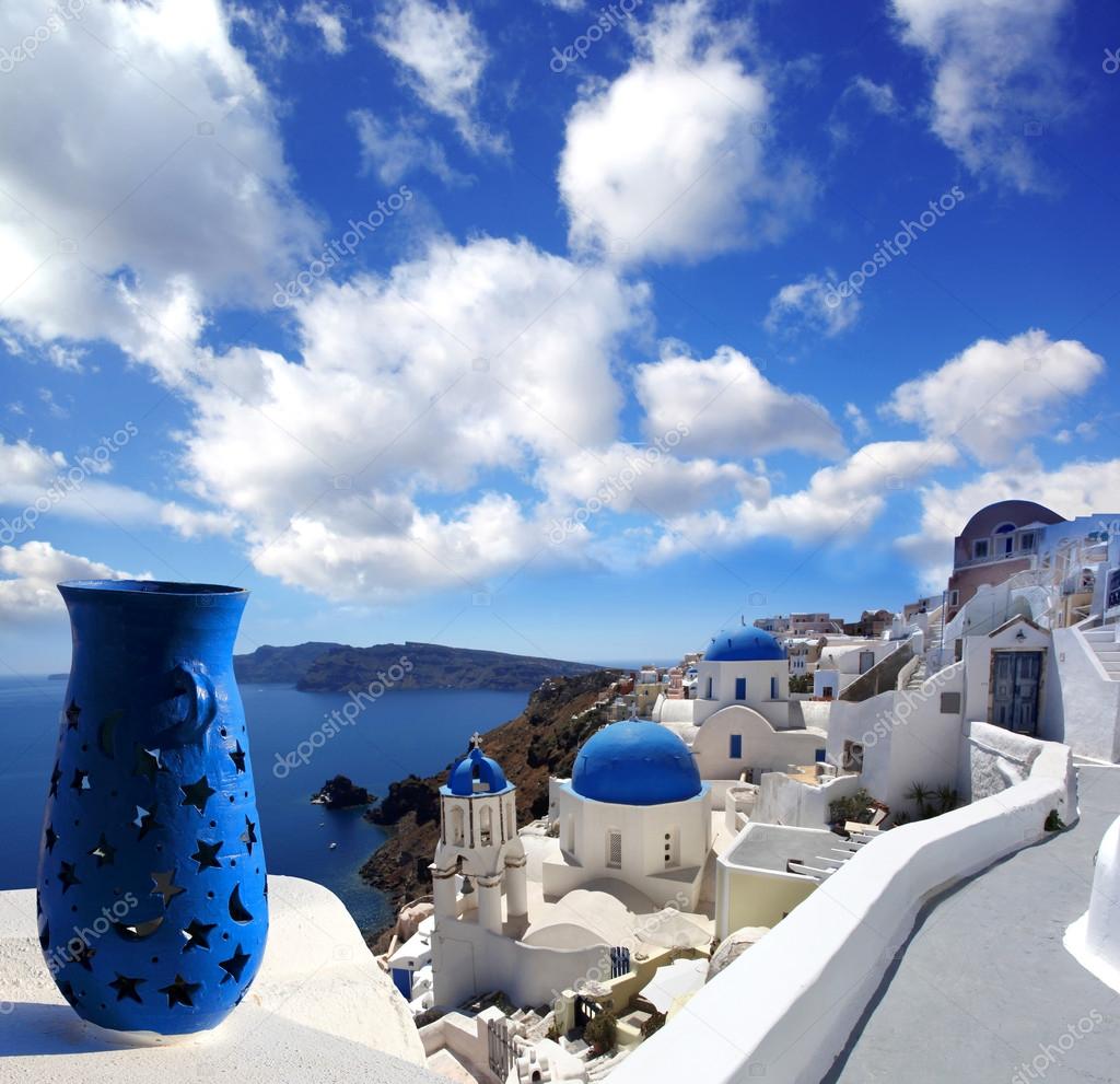 Santorini island with church and blue vase in Greece