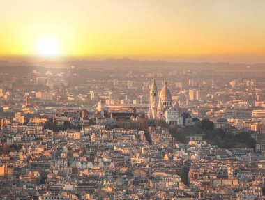 Panorama of Paris with Sacre Coeur Cathedral during golden hour in Paris, France