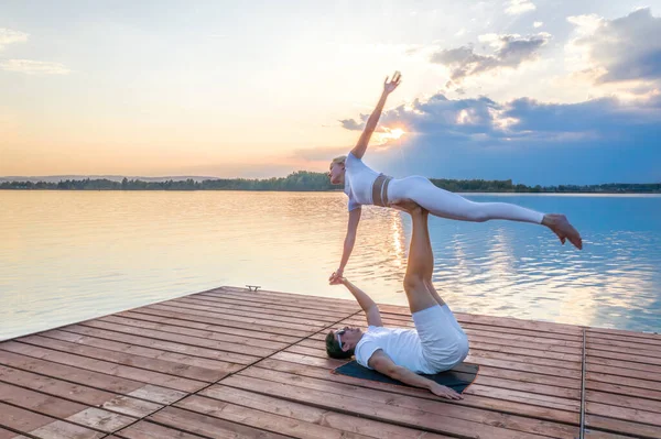 Beautiful Young Couple Doing Acro Yoga Pier Sunset Man Lying — Stock Photo, Image