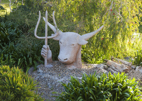 Sculpture of Zeus-bull with trident in his hand. Bingie. Nsw. Australia.