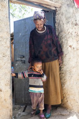 HARAR, ETHIOPIA - DECEMBER 24, 2013: Unidentified grandmother wi clipart