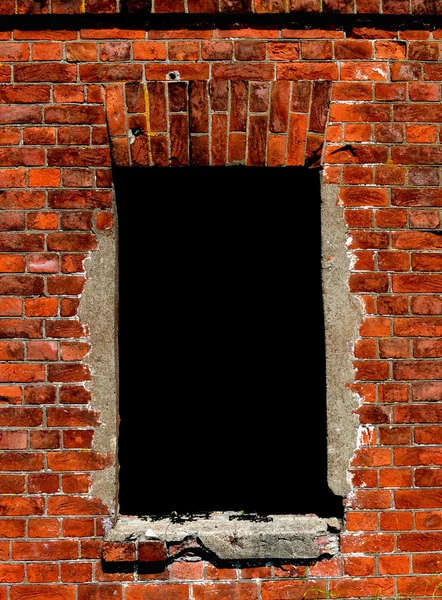 Een venster op een bakstenen muur — Stockfoto