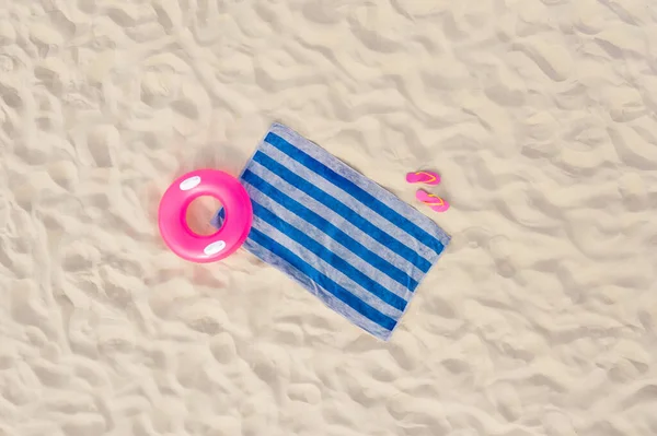 Striped Beach Towel Flip Flops Swim Ring Sand Aerial View — Stock Photo, Image