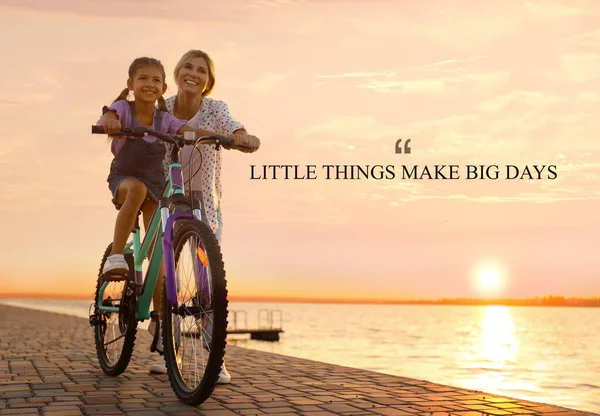 Little Things Make Big Days. Motivational quote reminding that moments of joy building up happy life or small things every day make big result. Text against view of mother teaching daughter to ride bicycle near river