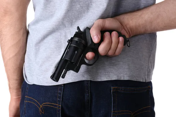 Άντρας Κρατώντας Όπλο Πίσω Από Την Πλάτη Του Λευκό Φόντο — Φωτογραφία Αρχείου