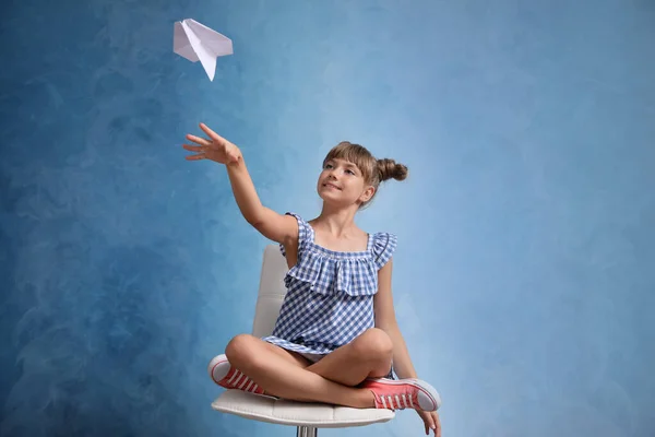 Cute Little Girl Playing Paper Plane Light Blue Background — Stock Photo, Image