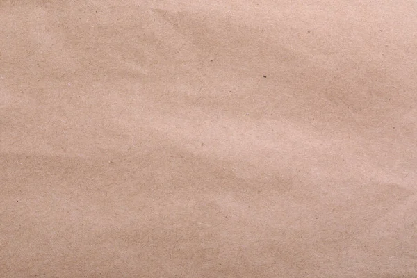 Texture of kraft paper bag as background, closeup