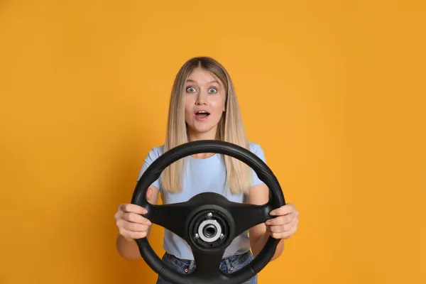 Emotional Young Woman Steering Wheel Yellow Background — Stock Photo, Image