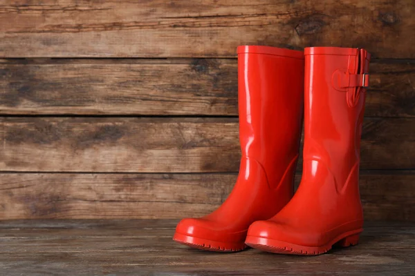 Pair Red Rubber Boots Wooden Surface Space Text — Stock Photo, Image