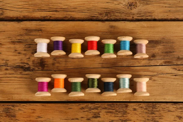 Different Colorful Sewing Threads Wooden Background Flat Lay — Stock Photo, Image