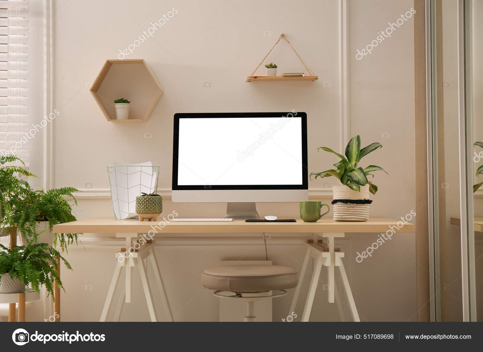 Modern home office setup with modern computer and houseplants with