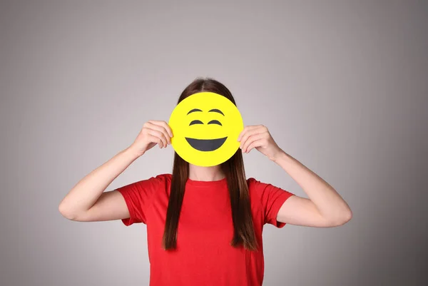 Woman Covering Face Laughing Emoji Grey Background — Stock Photo, Image