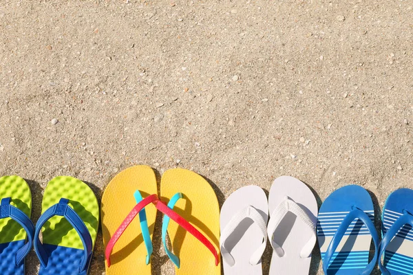 Many Different Flip Flops Sand Flat Lay Space Text — Stock Photo, Image
