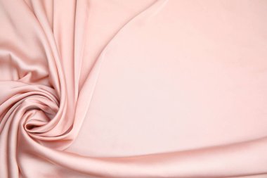 Arka plan olarak narin pembe ipeğin dokusu, üst görünüm