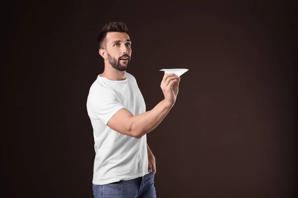 Handsome Man Playing Paper Plane Brown Background — Stock Photo, Image