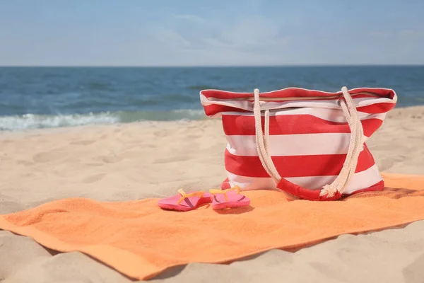 Soft Orange Beach Towel Bag Flip Flops Sandy Seashore Space — Stock Photo, Image