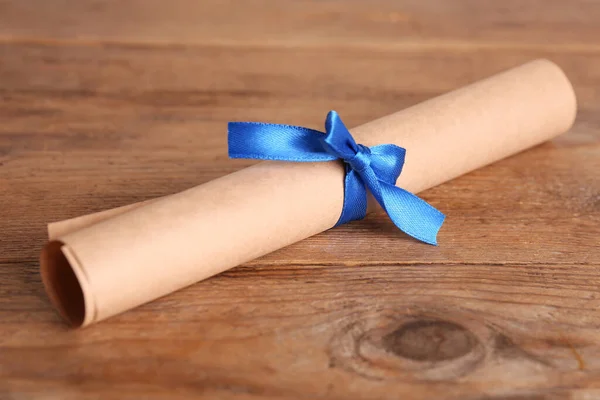 Rolled Student Diploma Blue Ribbon Wooden Table — Stock Photo, Image