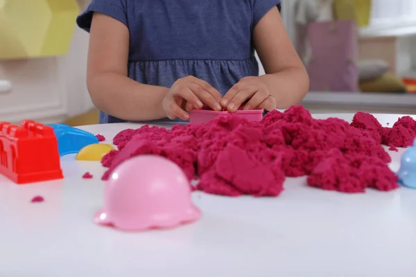 Little Girl Playing Bright Kinetic Sand Table Indoors Closeup — Stock Photo, Image