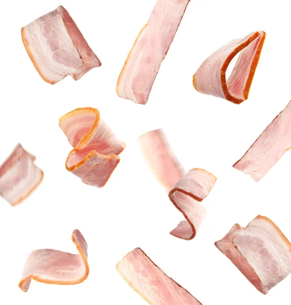 Delicioso Bacon Defumado Caindo Fundo Branco — Fotografia de Stock