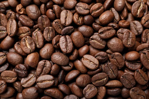 Högen Med Rostade Kaffebönor Som Bakgrund Ovanifrån — Stockfoto