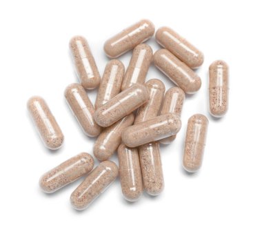 Beyaz arkaplanda birçok şeffaf jelatin kapsülü, üst görünüm